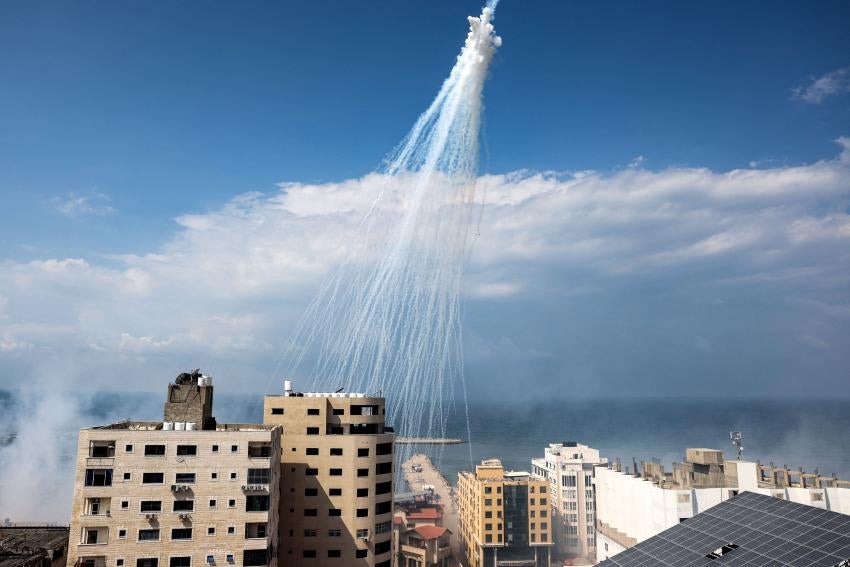 Airbursts of artillery-fired white phosphorus fall over the Gaza city port, October 11, 2023. Airbursts of artillery-fired white phosphorus fall over the Gaza city port, October 11, 2023.